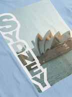 T-shirt with Sydney Opera House design and 'Sydney' text on a light blue background